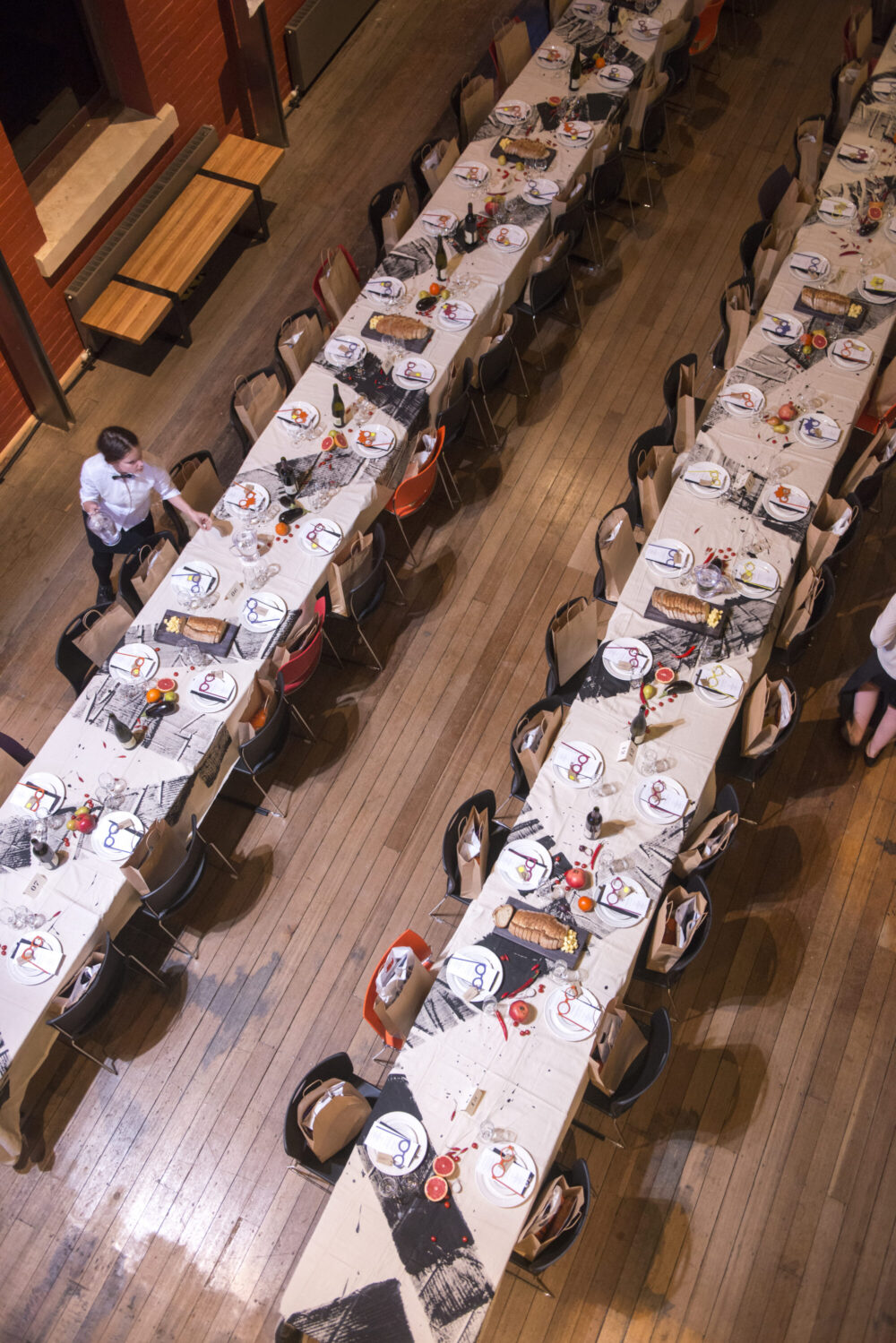 Tables with painted tablecloths on the timber floor of the main museum void space